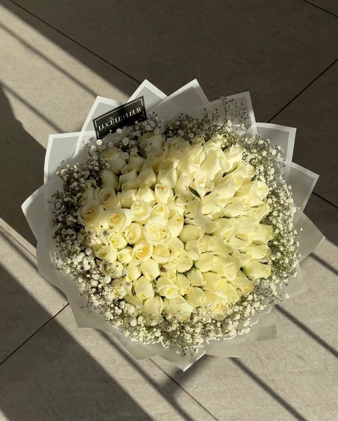 White rose bouquets with baby’s breath/ Gyp