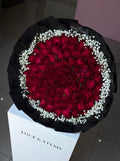 Red rose bouquet with baby’s breath (layered wrapping)