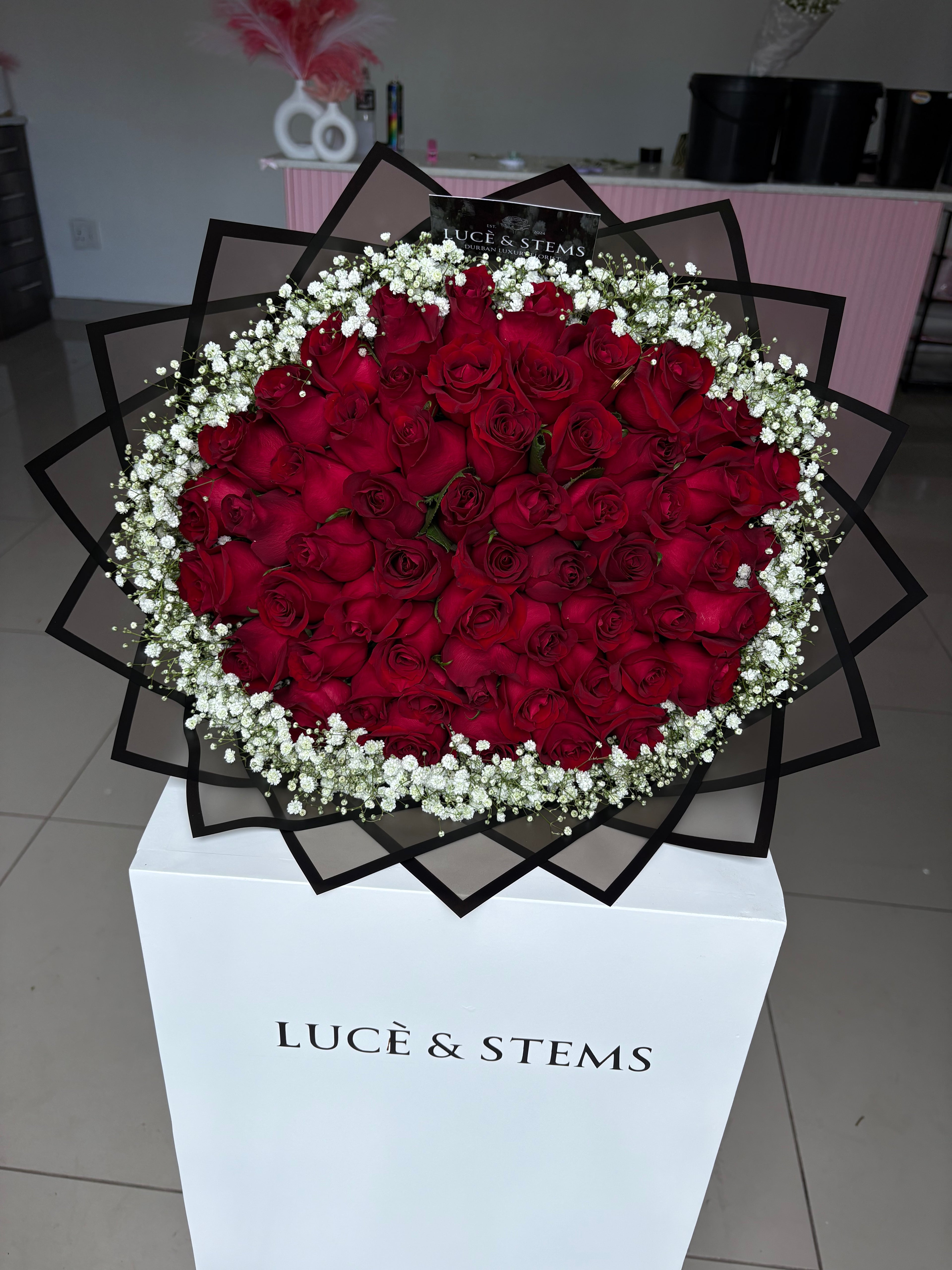 Red rose bouquets with baby’s breath/ Gyp