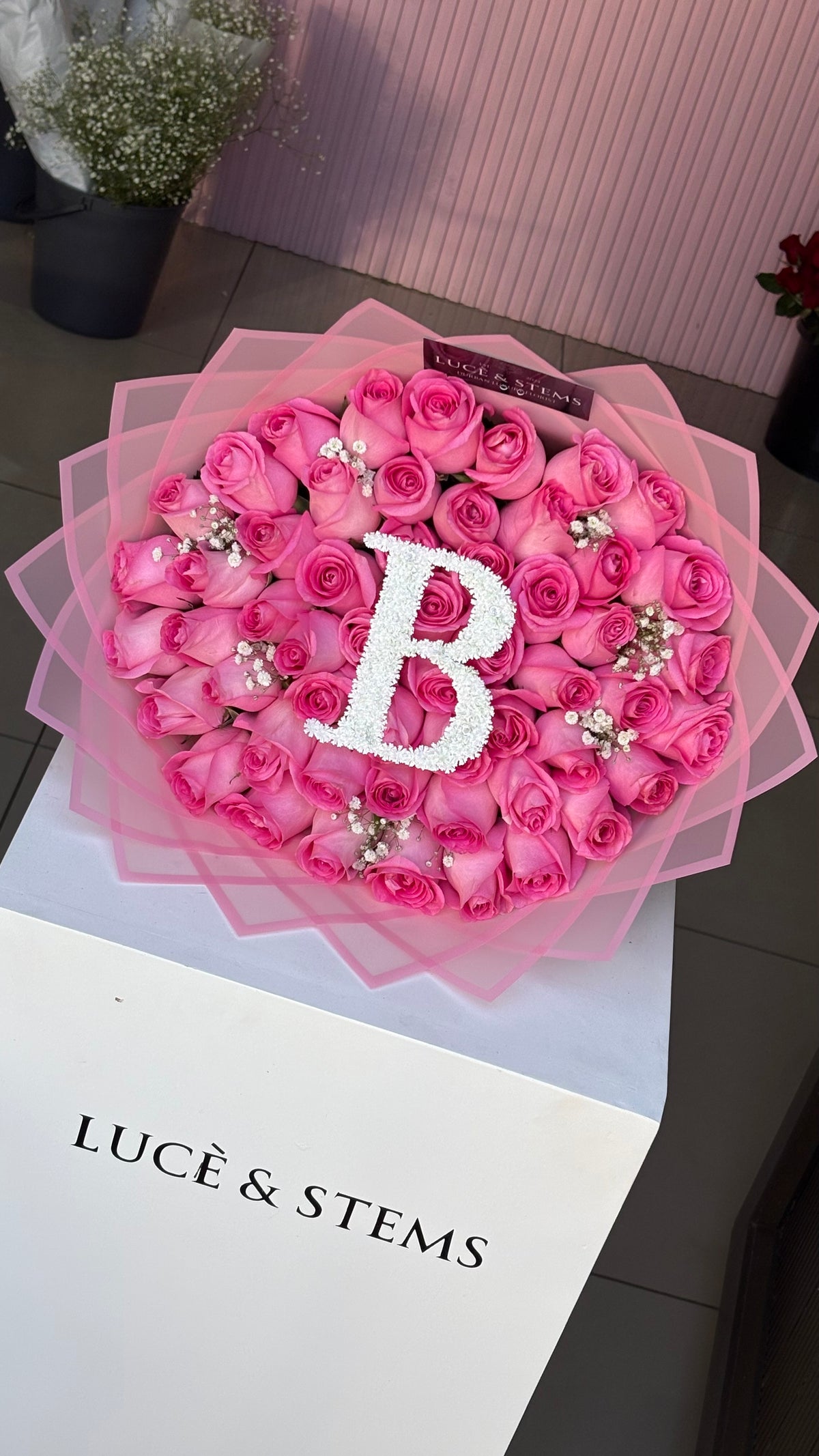 Pink Rose bouquets with an initial and baby’s breath