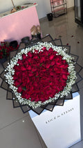 Red rose bouquets with baby’s breath/ Gyp