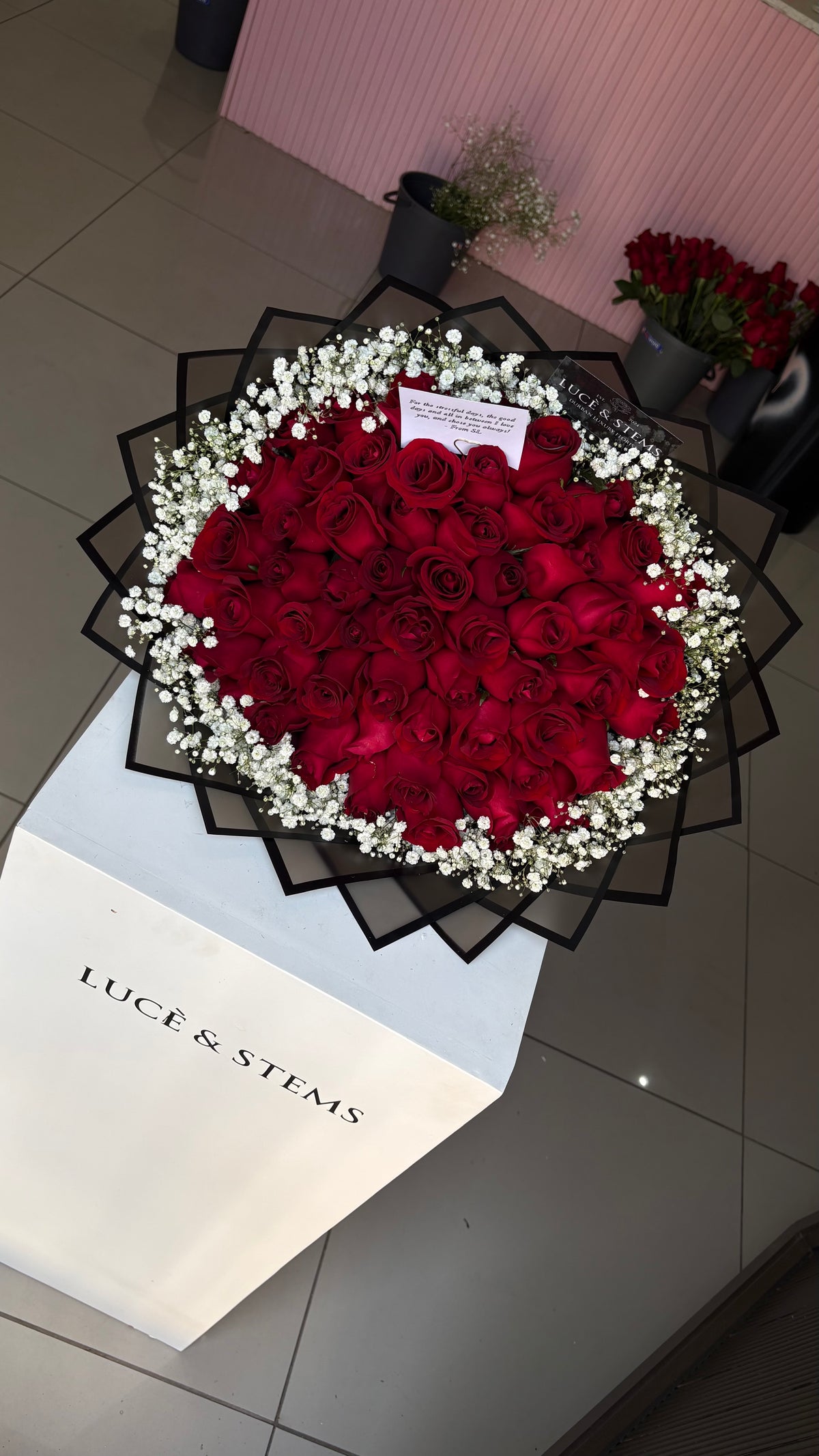 Red rose bouquets with baby’s breath/ Gyp